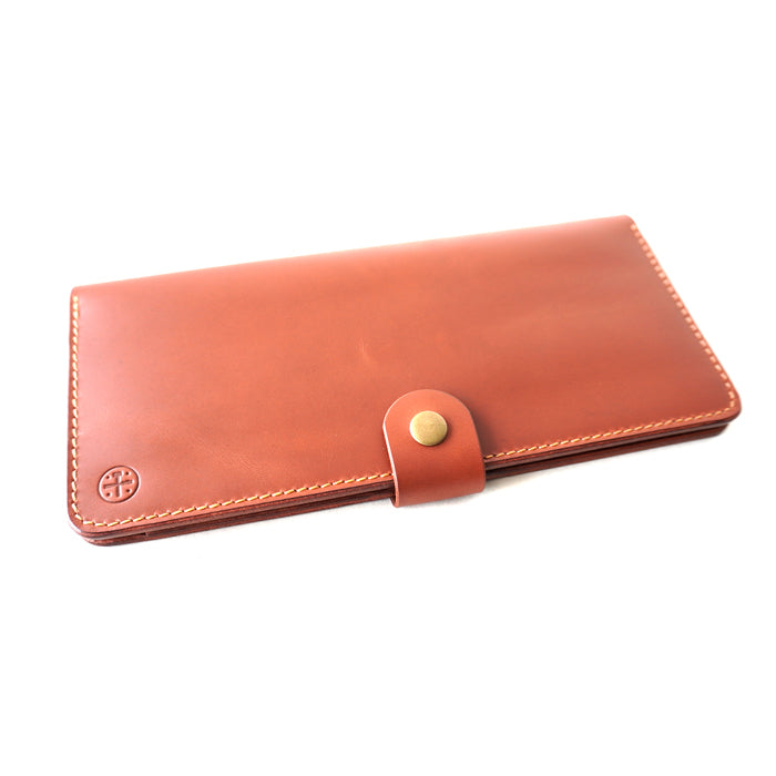 Handmade_leather_cheque_wallet_with_a_antique_button_profile view